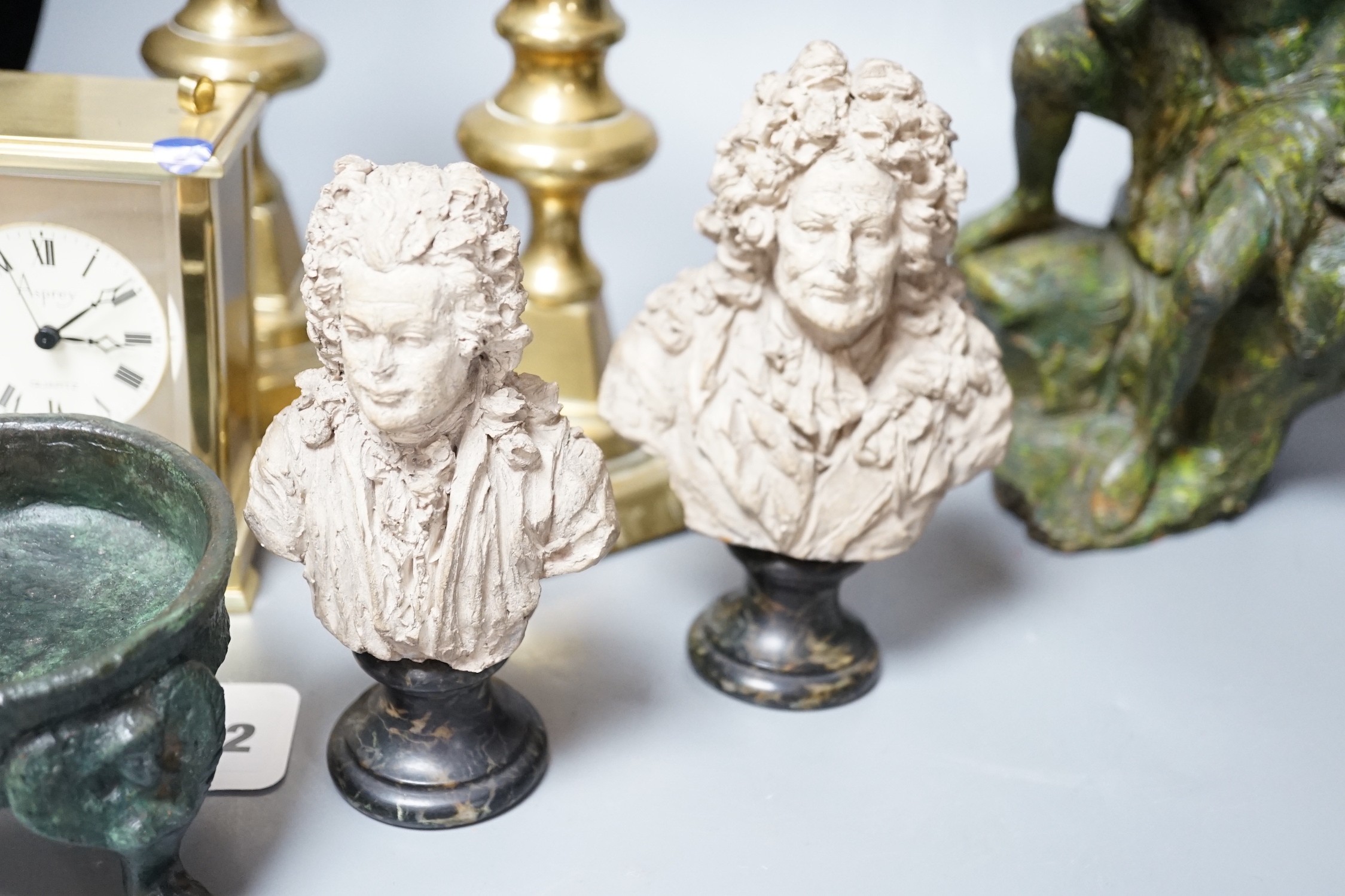 A pair of small terracotta busts after Chinard, a glazed pottery figure, a pair of Victorian brass candlesticks, Asprey retailed timepiece etc. tallest 25cm